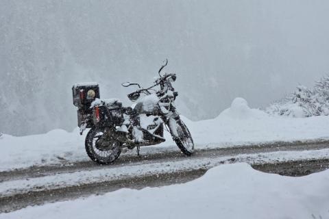 A motorcycle on a snowy Himachal road