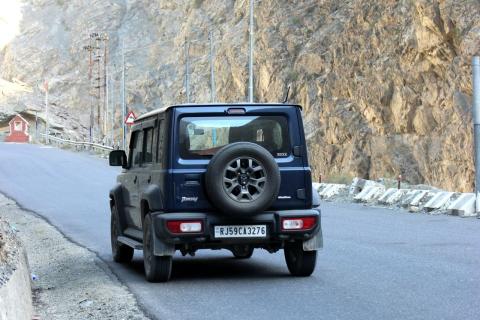 An SUV on a Himachal mountain road